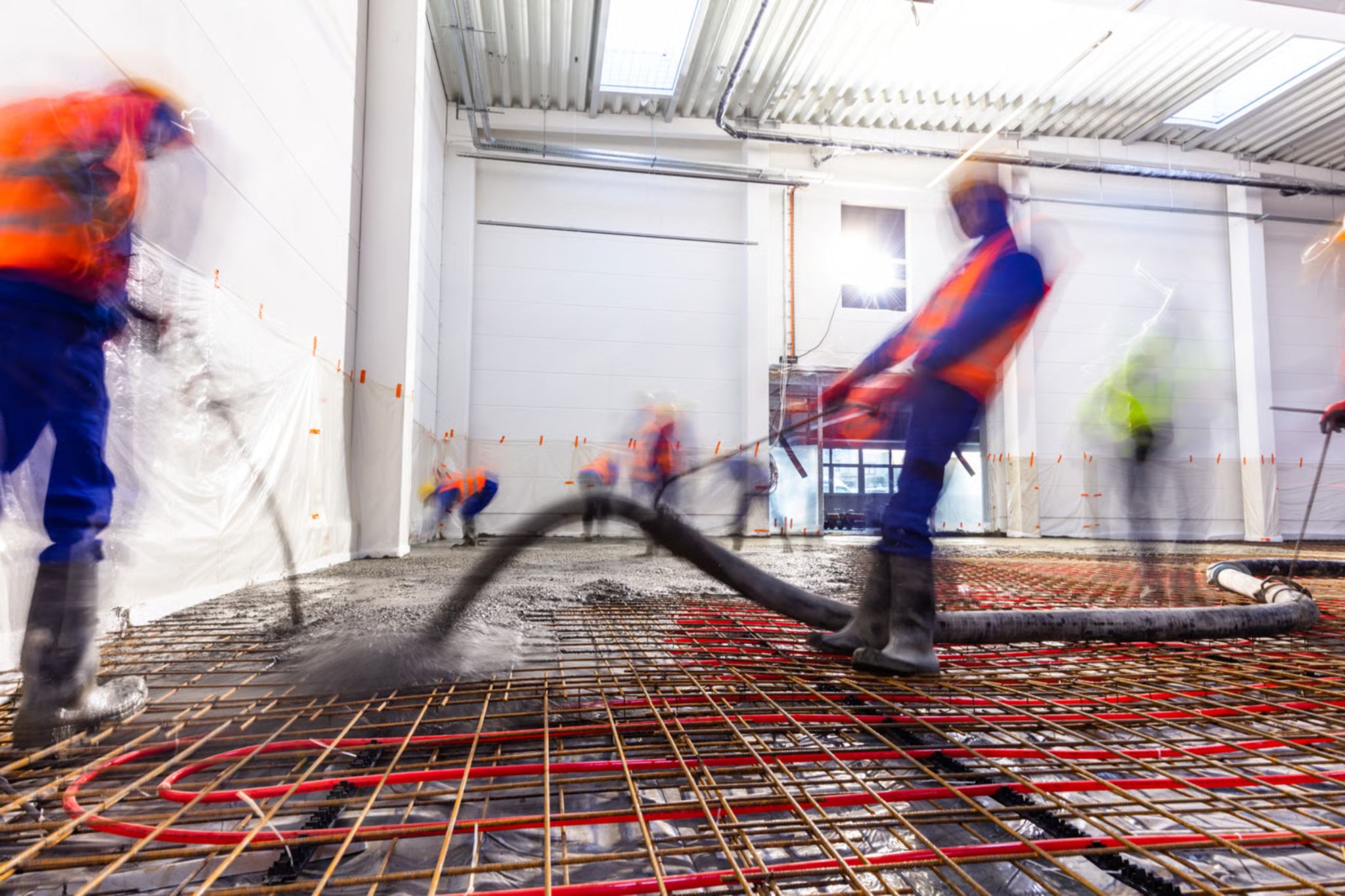 Professional concreting team working on driveway installation in Springvale